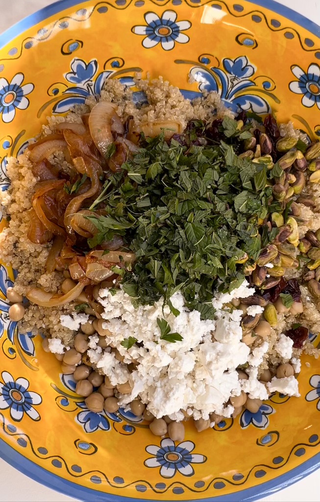 Fall quinoa salad topped with fresh mint and parsley