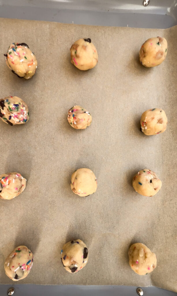 Sprinkle cookie dough balls rolled and placed on prepared baking sheet.