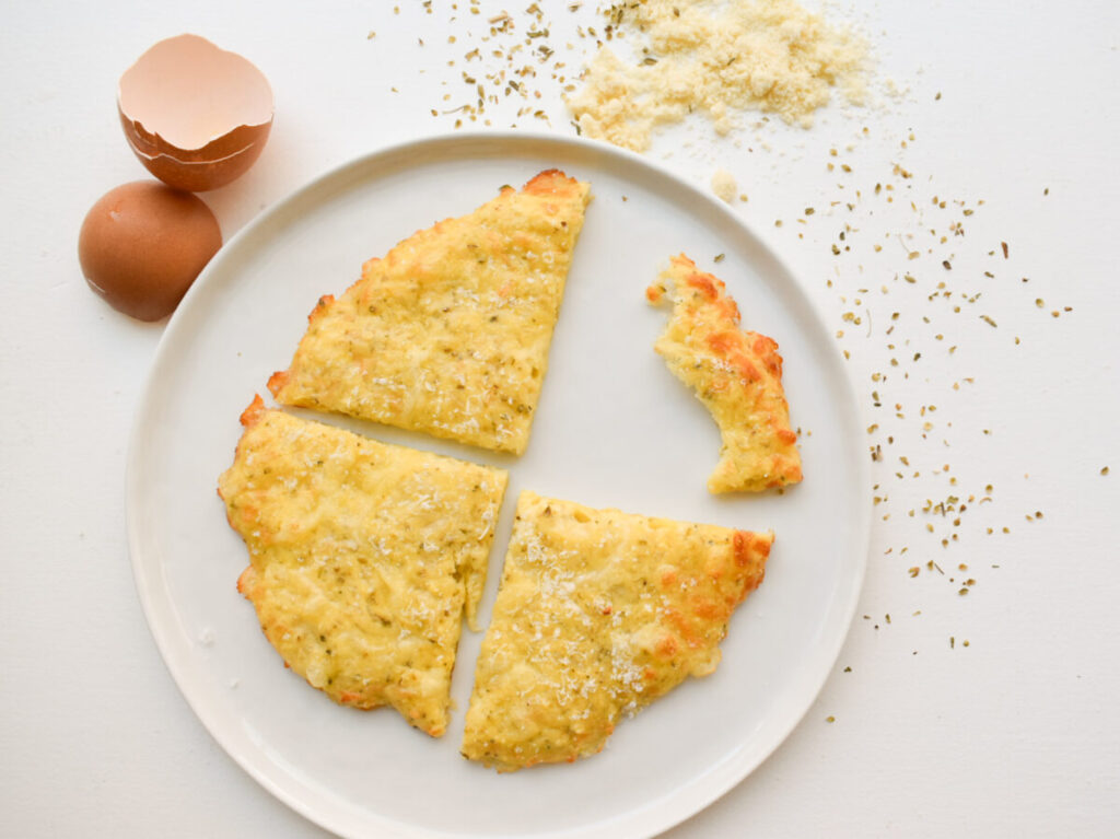 Keto bread made with cheese, almond flour, egg, and seasoning.