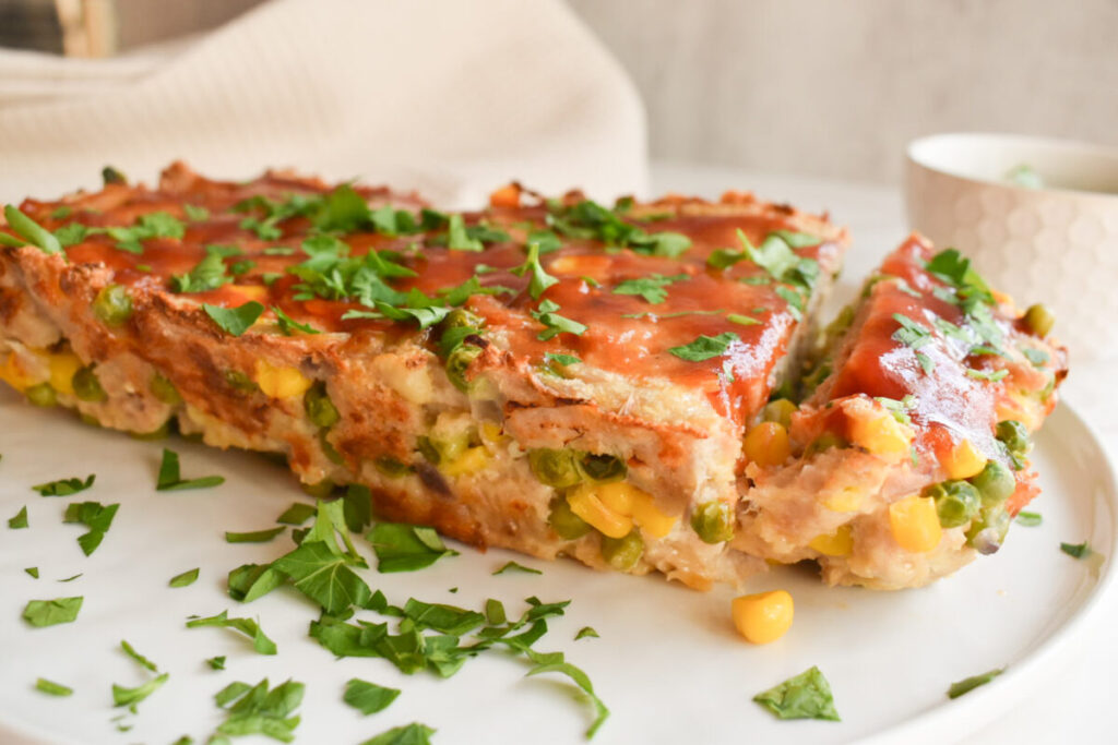 Turkey meatloaf topped with fresh herbs
