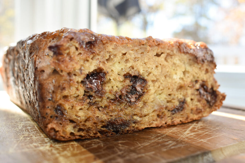 Fresh banana bread with melted chocolate chips inside.