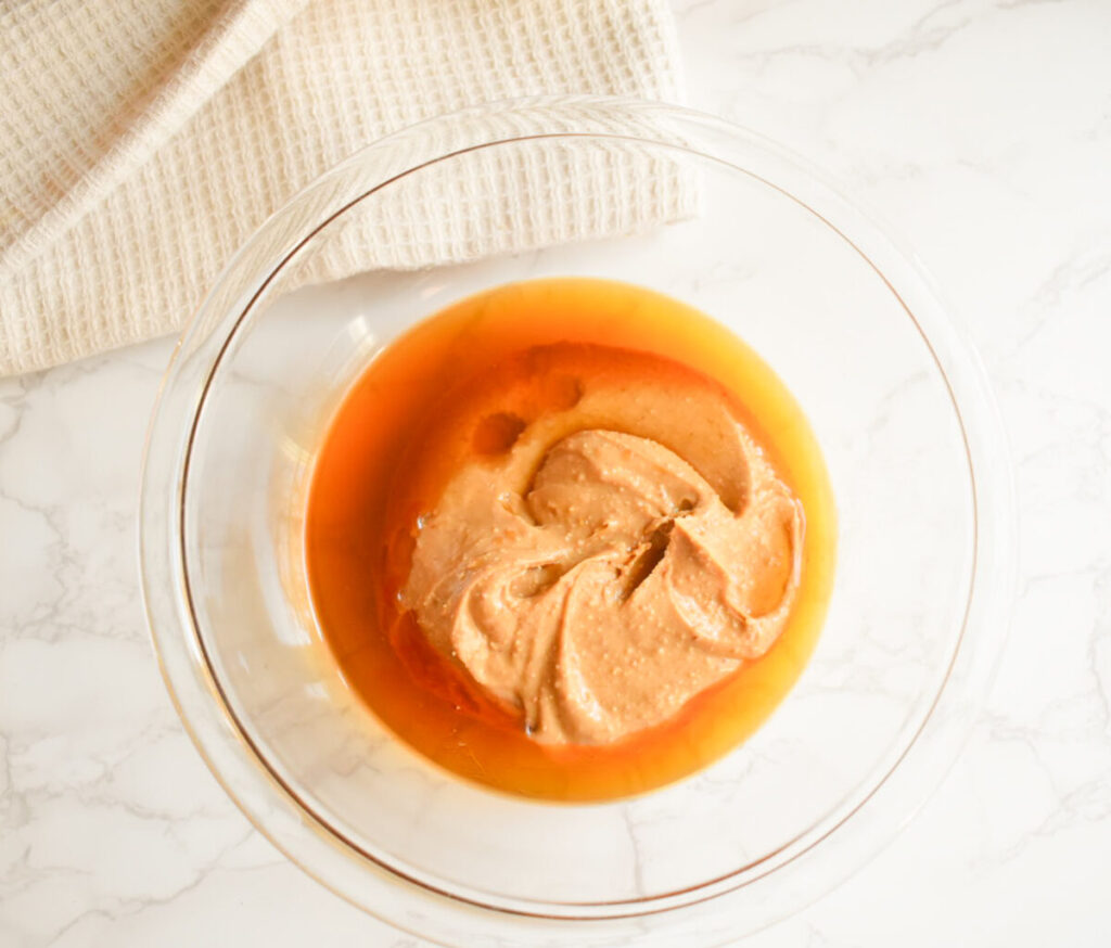 Combine peanut butter and honey in a microwave safe bowl
