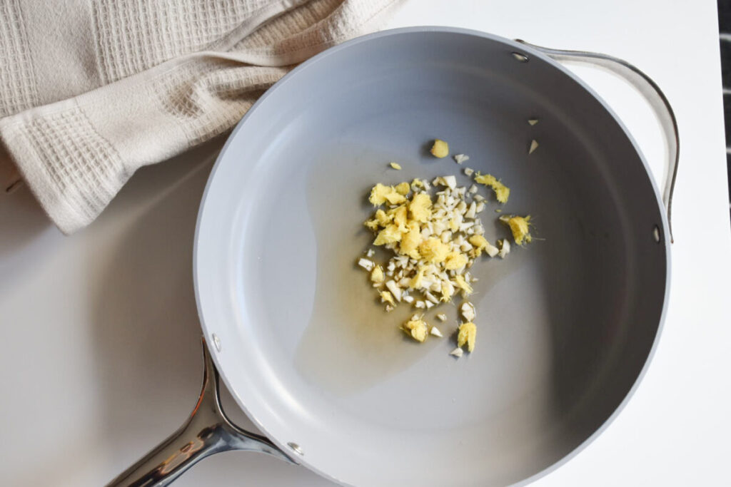 aromatics ginger and garlic heating in sesame oil