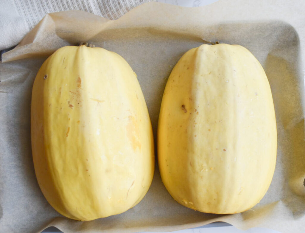 spaghetti squash cut side down ready to be roasted