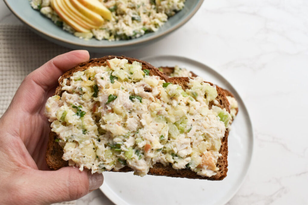 chicken salad with celery and apples served over whole grain toast