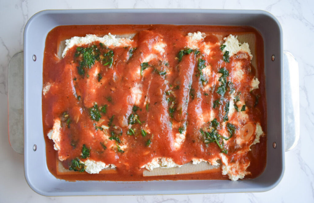 zucchini lasagna topped with marinara sauce