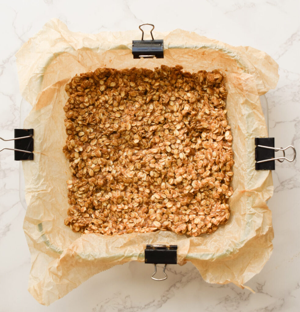 press oatmeal mixture into prepared baking dish for no-bake bars