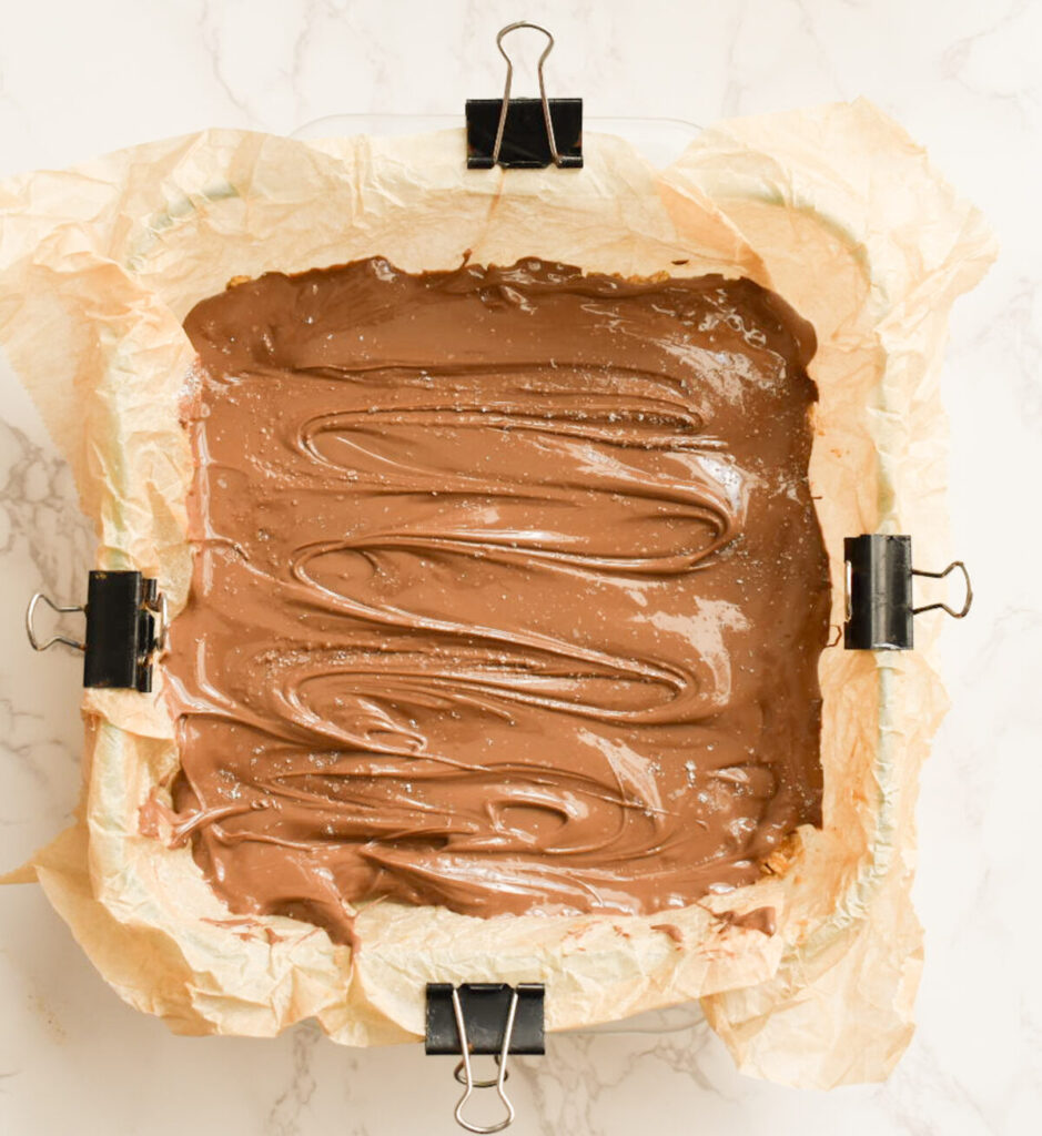 no-bake oatmeal bars topped with melted chocolate