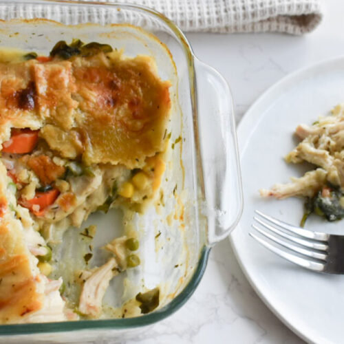 homemade chicken pot pie made in casserole dish and topped with puff pastry