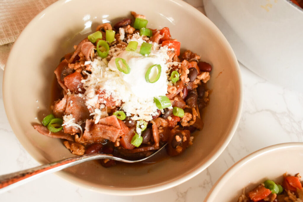 turkey chili served with sour cream and green onions