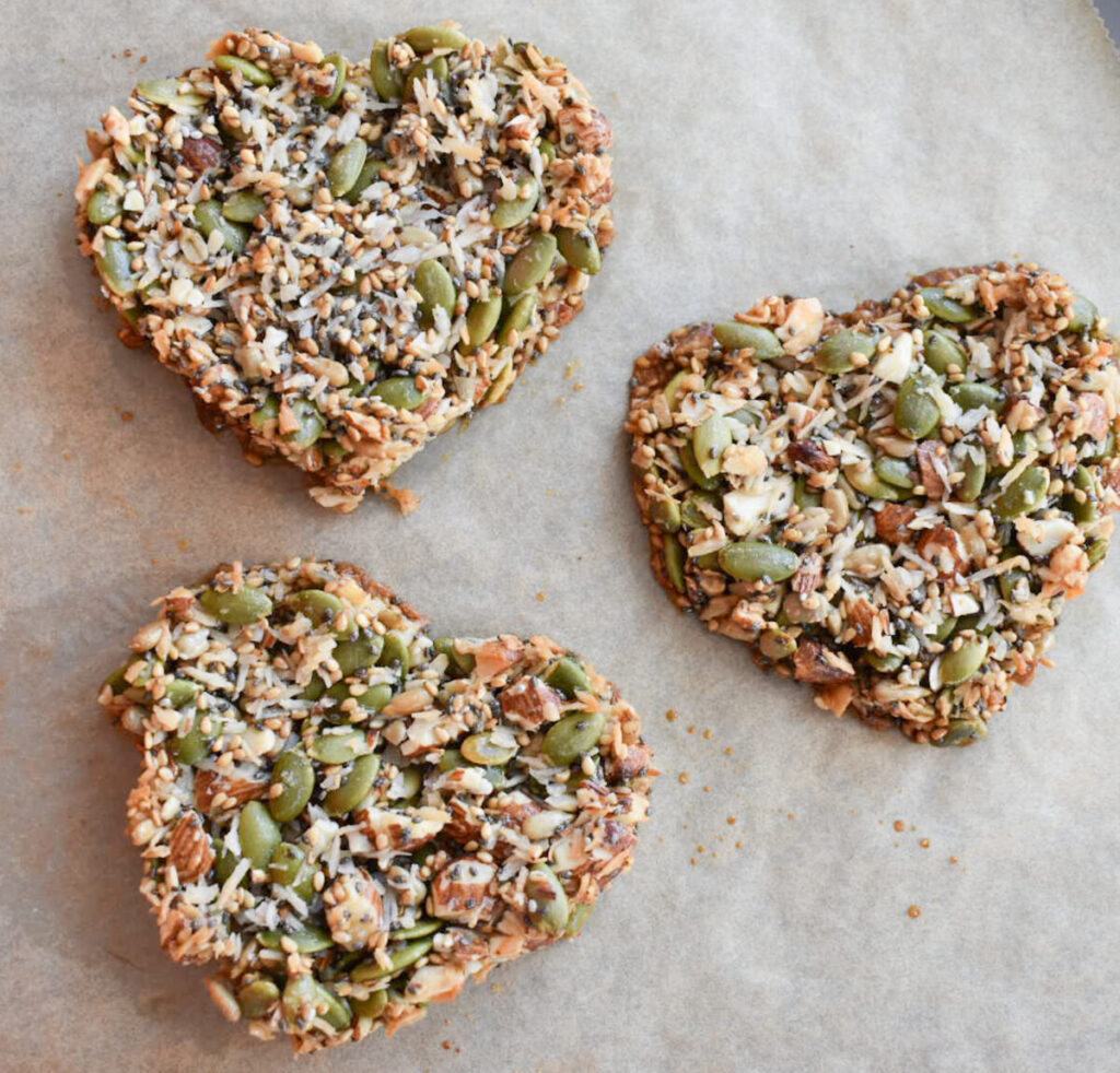 cooked granola bars with nuts and seeds in the shape of hearts