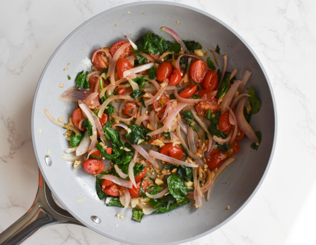 sauteed onions, tomatoes, and spinach for baked egg casserole