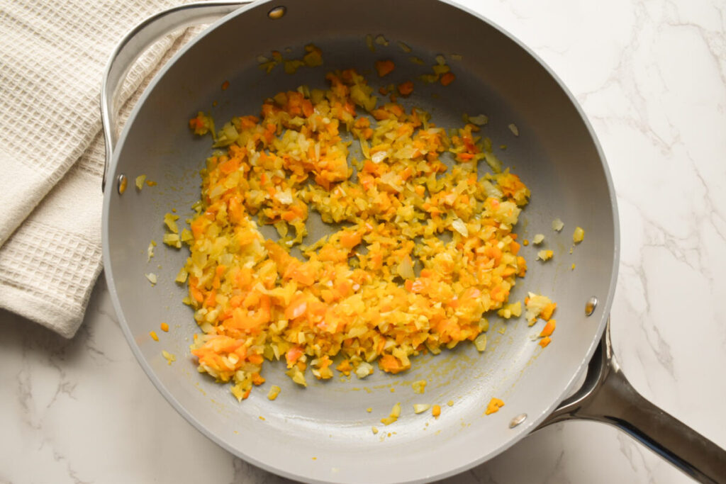 onion, garlic, and bell pepper sauteing in olive oil